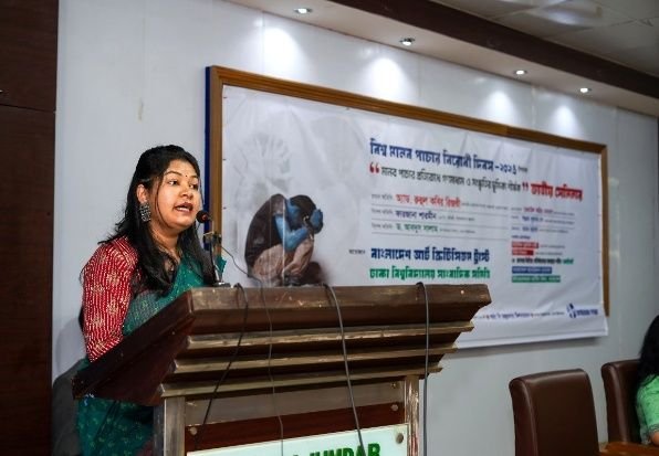 A speaker at the podium during the national seminar